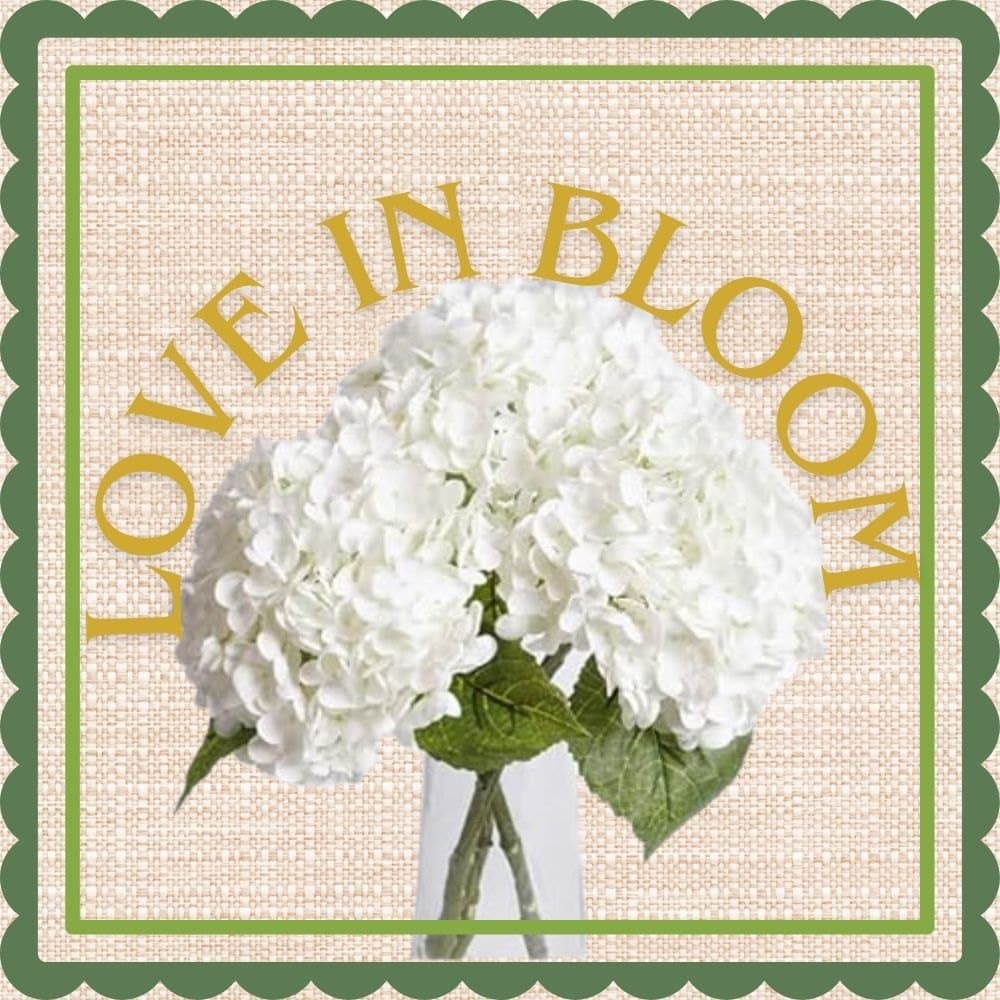 White real-touch hydrangea stems in a glass vase